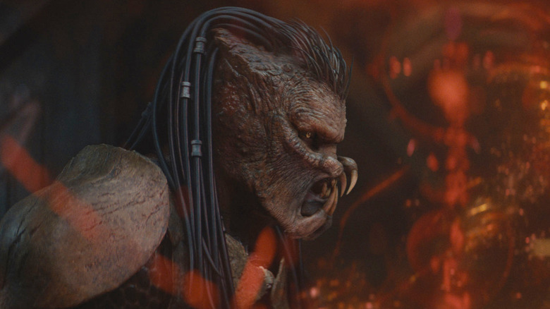 Dimitrius Schuster-Koloamatangi strikes a fierce pose as Dek in Predator: Badlands