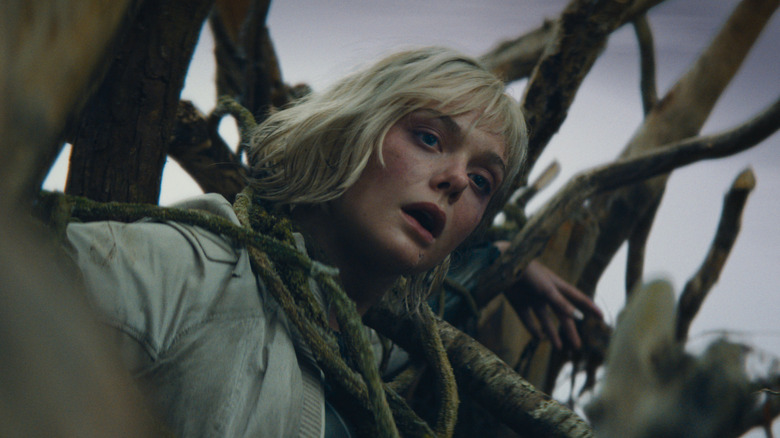 Elle Fanning as Thia stuck in a tree in Predator: Badlands