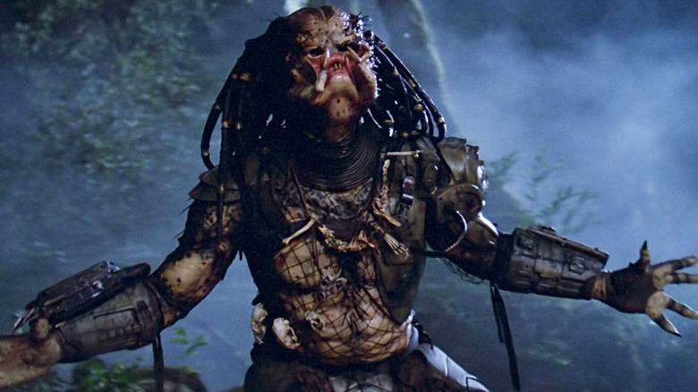 The alien from Predator roaring in the jungle.