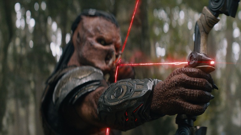 Dek aims at a native species of Genna in Predator: Badlands