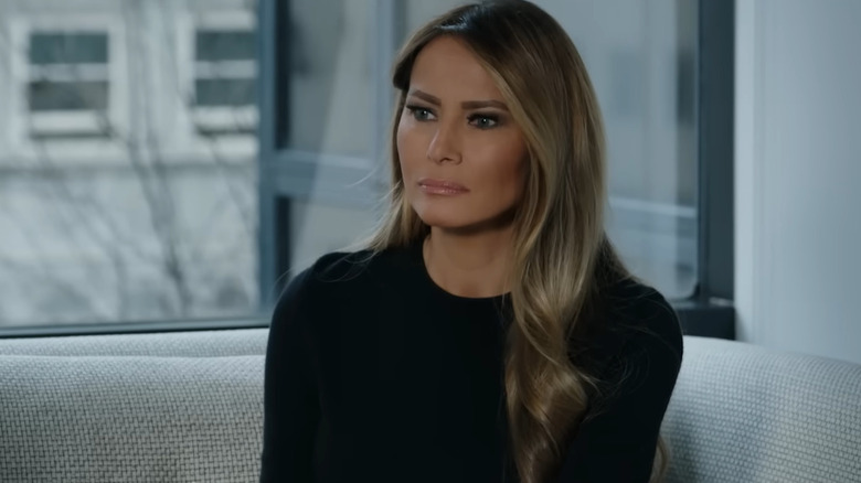 Melania Trump sitting on a couch in Melania