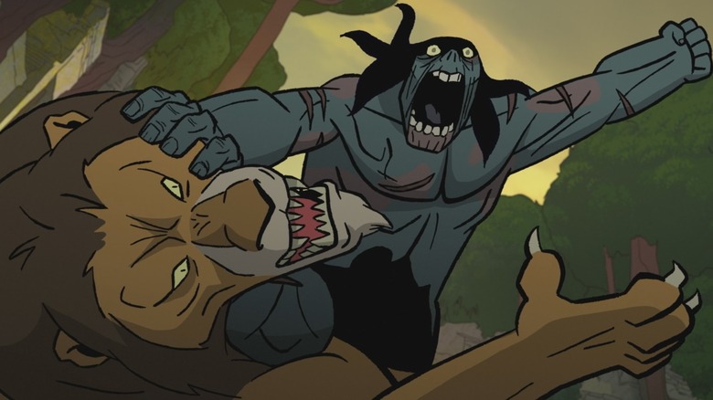 Une lance zombie tenant un lion à distance avant vraisemblablement de le déchirer en morceaux dans Primal