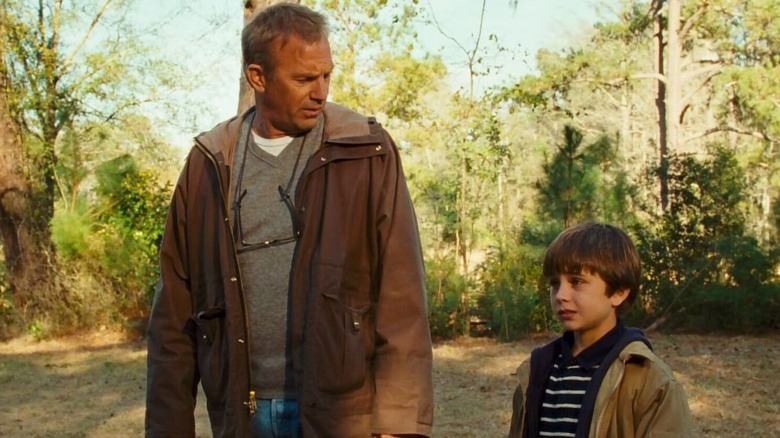 John James looking down at his son in The New Daughter