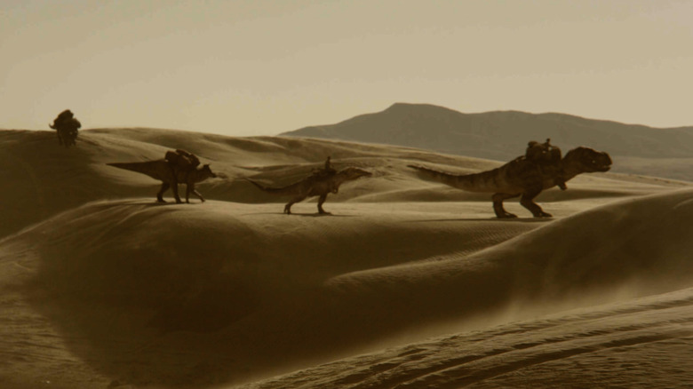 People riding dinosaurs in the desert in Dinosaurs of the Wild West