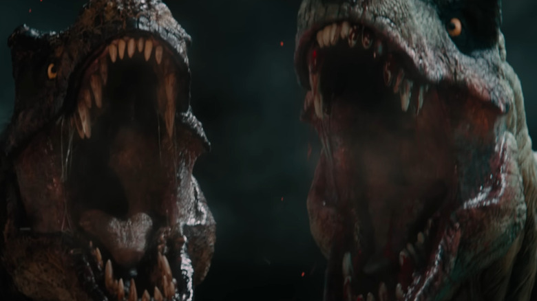 Two T-rexes roaring side by side in Primitive War