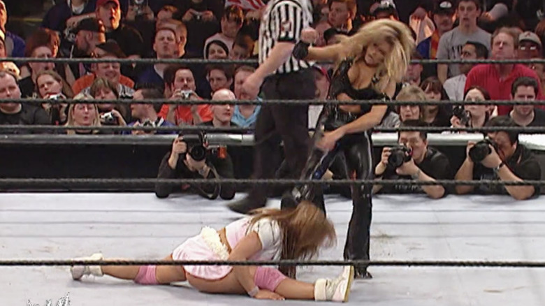 Trish Stratus kicks Mickie James in the head