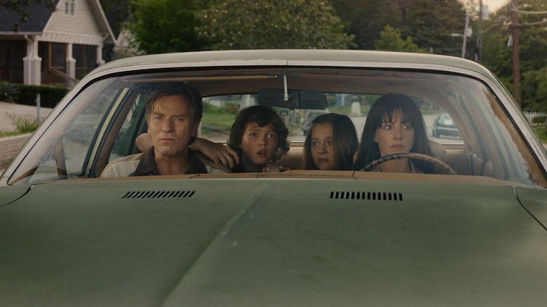 The Platt family in their car in The End of Oak Street