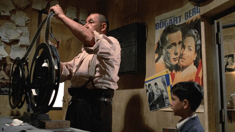 The young Salvatore watching Alfredo handle film in Cinema Paradiso