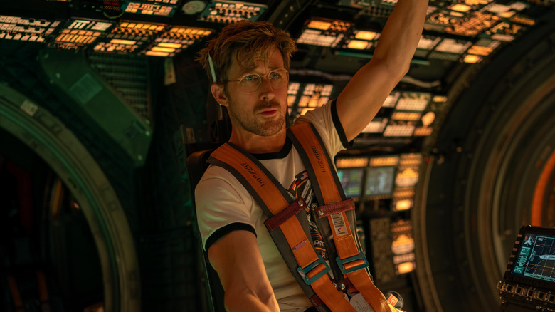 Ryan Gosling as Ryland Grace sitting in the cockpit of his ship in Project Hail Mary