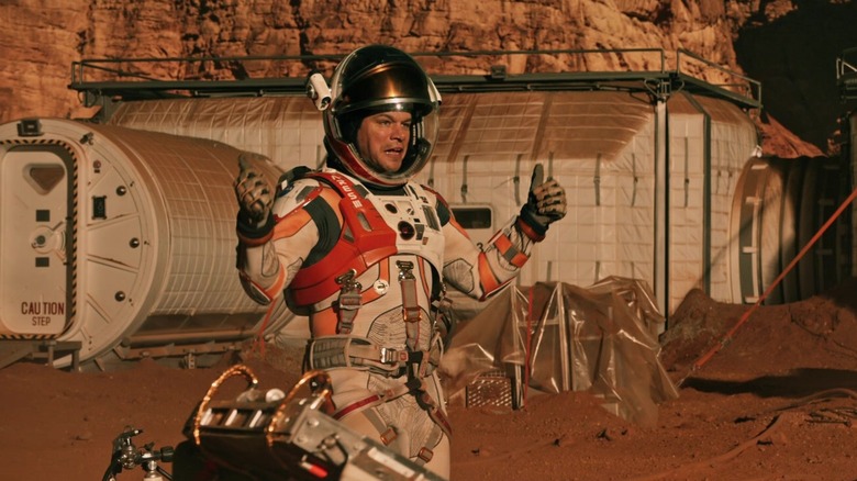 Matt Damon as Mark giving a thumbs up to the camera in The Martian