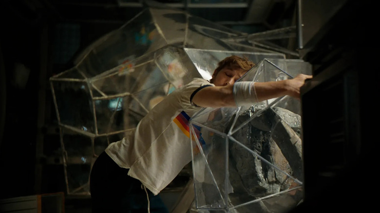 Ryan Gosling as Ryland Grace hugging Rocky in his ball in Project Hail Mary