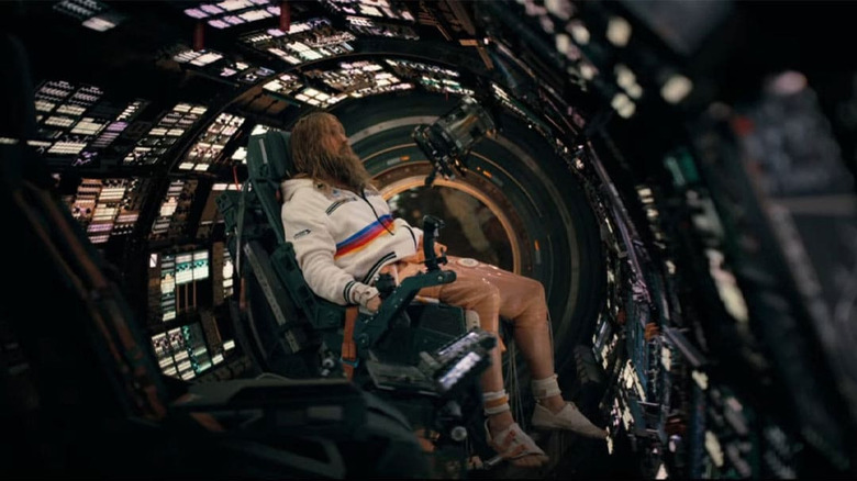 Ryan Gosling as Ryland Grace, bearded and half-dressed in the ship's pilot chair in Project Hail Mary