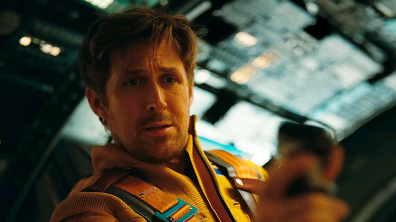 Ryland Grace looks concerned as he pilots his spaceship in Project Hail Mary