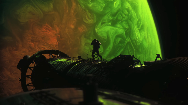 Ryan Gosling's Dr. Ryland Grace floats in space in front of a planet in Project Hail Mary