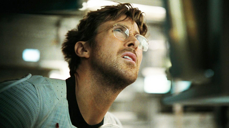 Ryan Gosling's Ryland Grace squints as he looks up while on his spaceship in Project Hail Mary