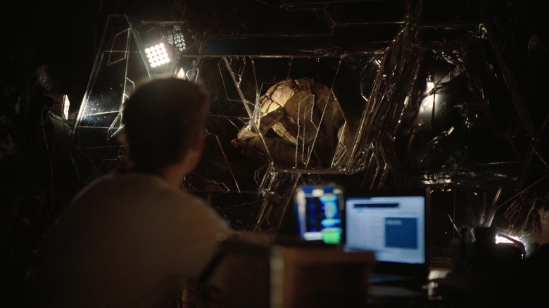 Ryan Gosling's Rylan Grace sits on his laptops watching Rocky in Project Hail Mary