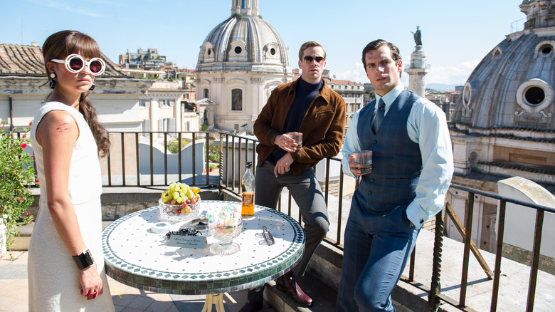 Alicia Vikander as Gaby Teller, Armie Hammer as Illya Kuryakin and Henry Cavill as Napoleon Solo look stylish and deadly in The Man from U.N.C.L.E.