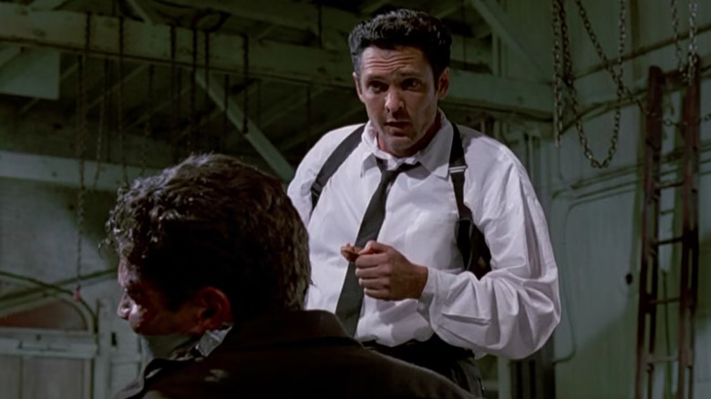 Reservoir Dogs, Mr. Blonde preparing to cut a tied-up Marvin Nash's ear off