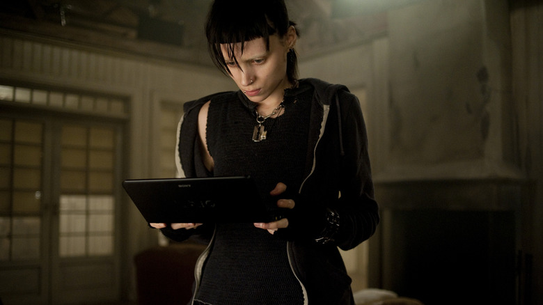 Lisbeth Salander looking at a tablet in The Girl with the Dragon Tattoo