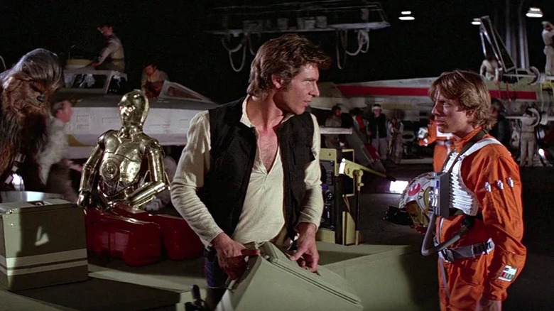 Han and Luke talking at the Rebel base in Star Wars: A New Hope