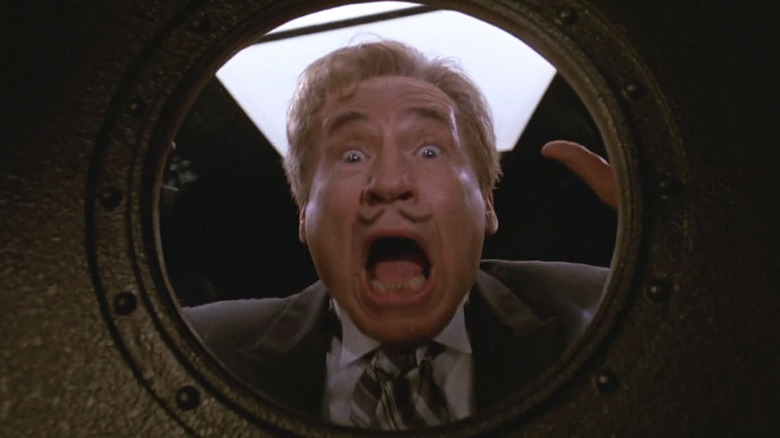 Mel Brooks as President Skroob, screaming through a porthole window toward the camera in Spaceballs