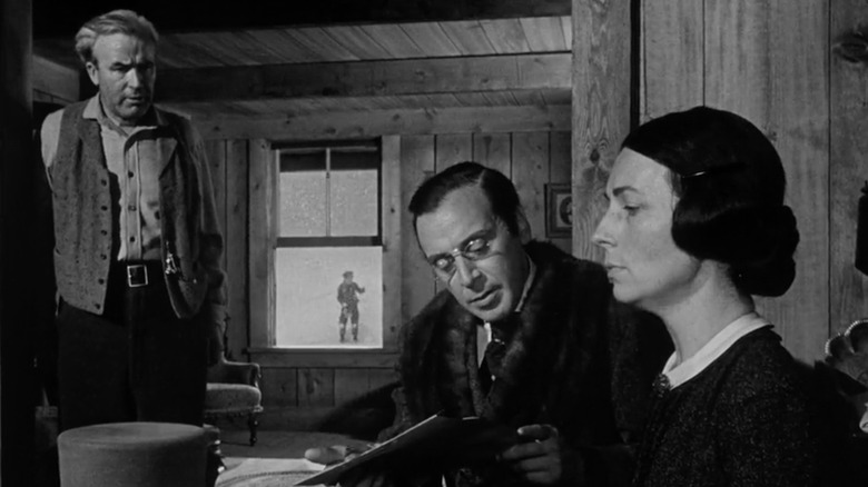 Agnes Moorehead as Mary Kane, Harry Shannon as Jim Kane, and George Coulouris as Walter Parks Thatcher sign away Charles Foster Kane's future in Citizen Kane