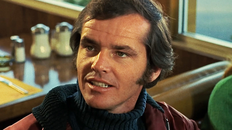 Jack Nicholson's Robert Eroica Dupea is seen in closeup as he sits in a diner booth in Five Easy Pieces
