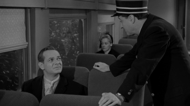 James Dali in the role of Williams Garta sitting in a train talking to Mosul in the Twilight Zone A in Willoughby