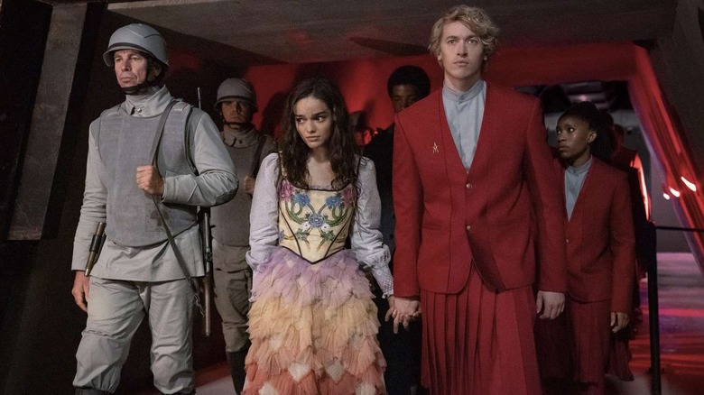 Coriolanus Snow bringing Lucy Gray Baird into the Capitol in The Hunger Games: The Ballad of Songbirds and Snakes