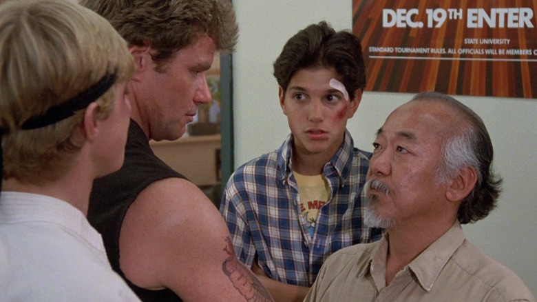 William Zabka, Martin Kove, Ralph Macchio, and Pat Morita in The Karate Kid