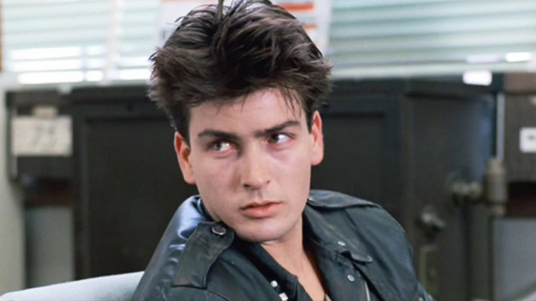 Charlie Sheen in Ferris Bueller's Day Off, wearing a leather jacket and with feathery hair