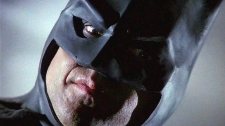Michael Keaton as Batman, grimacing.