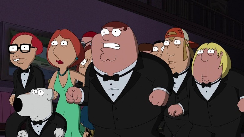 Griffin Family standing scared in formal clothes