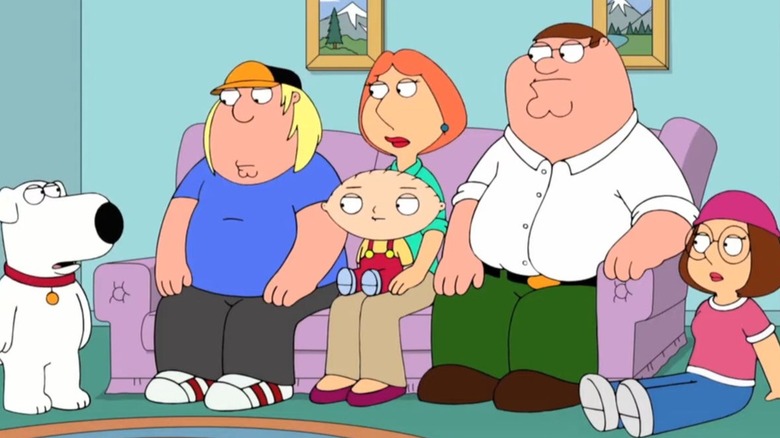 Griffin family sitting on couch 