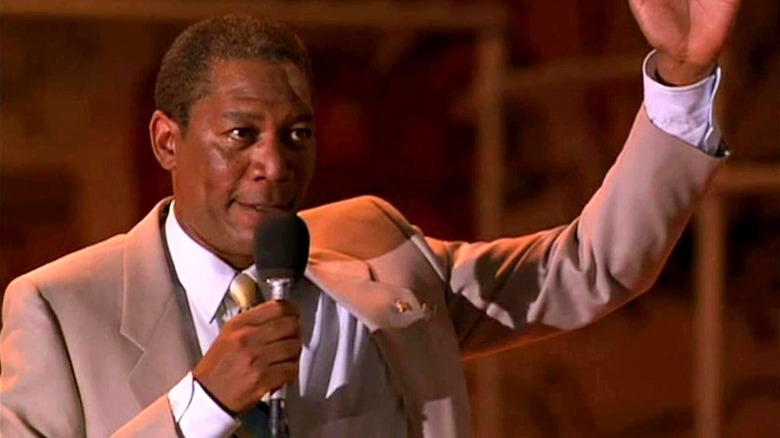 Joe Louis Clark (Morgan Freeman) rallies into a microphone in Lean on Me