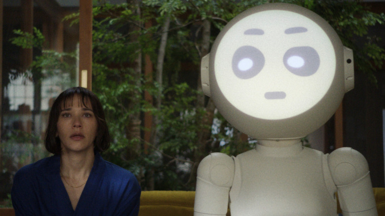 Rashida Jones as Suzie Sakamoto and Joanna Sotomura as Sunny sitting on a bench on Sunny