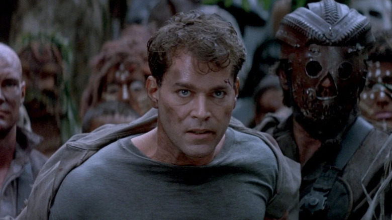 John Robbins being held captive by a gang in No Escape