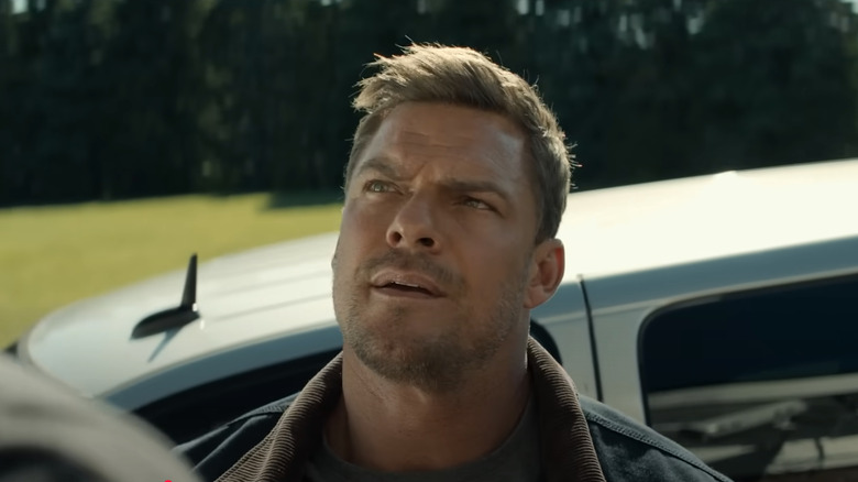 Jack Reacher looking up in surprise in Reacher Season 3