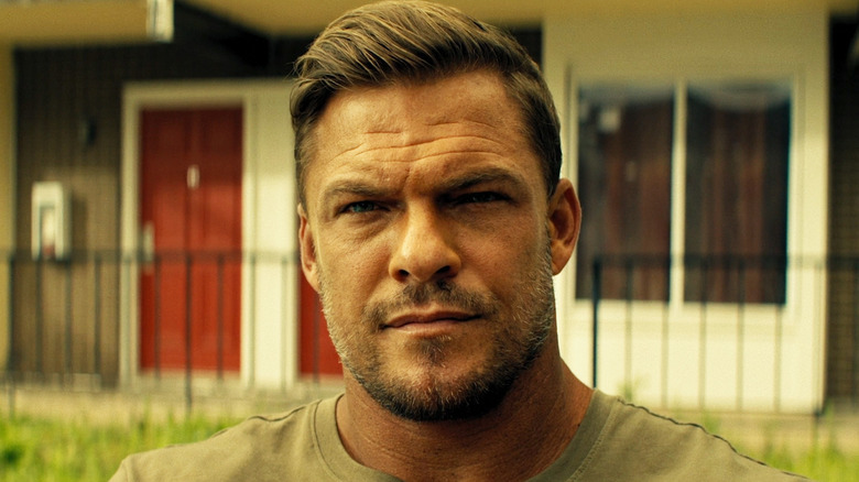 Alan Ritchson as Jack Reacher is seen in closeup in Reacher