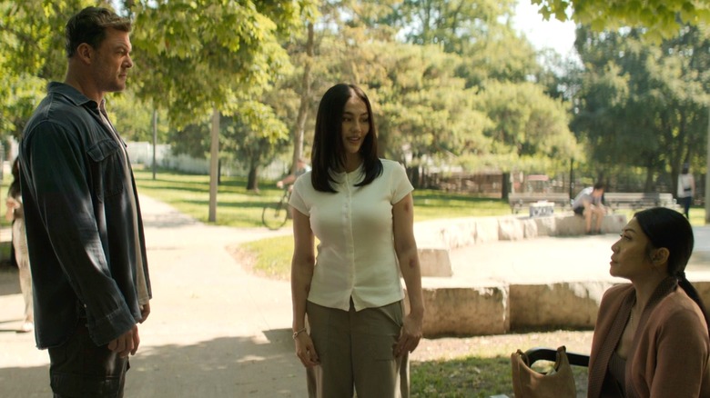 Alan Ritchson stands in a park opposite Agnez Mo's Lila Hoth and Anngun's Amisha Hoth in Reacher