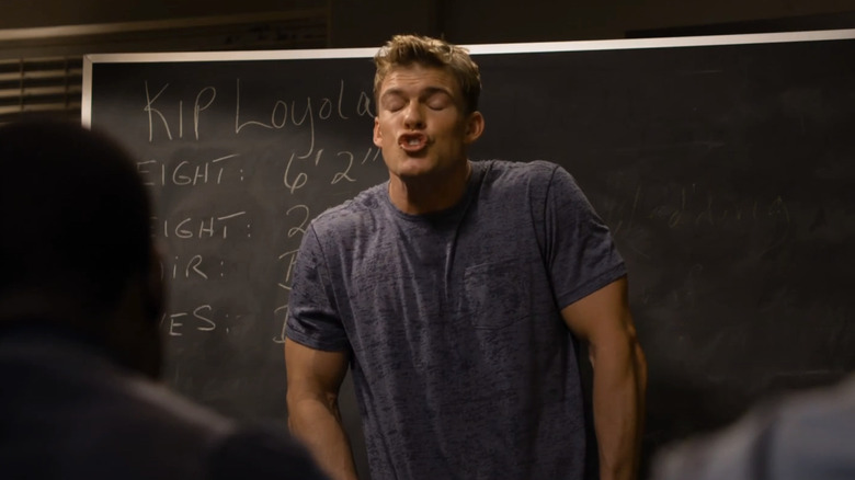 Alan Ritchson's Kip Loyola/Carew stutters as he stands in front of a blackboard in The Wedding RInger