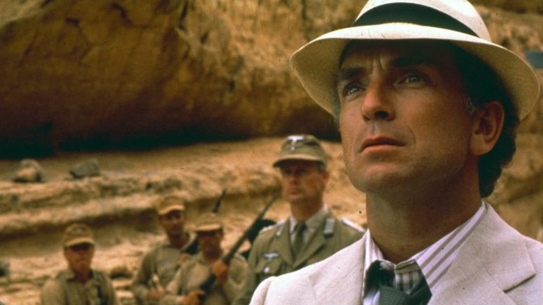 Belloq in front of soldiers