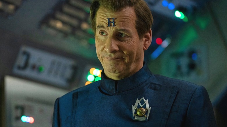 Chris Barrie's Arnold Rimmer shoots a sheepish look at his crewmates in Red Dwarf: The Promised Land
