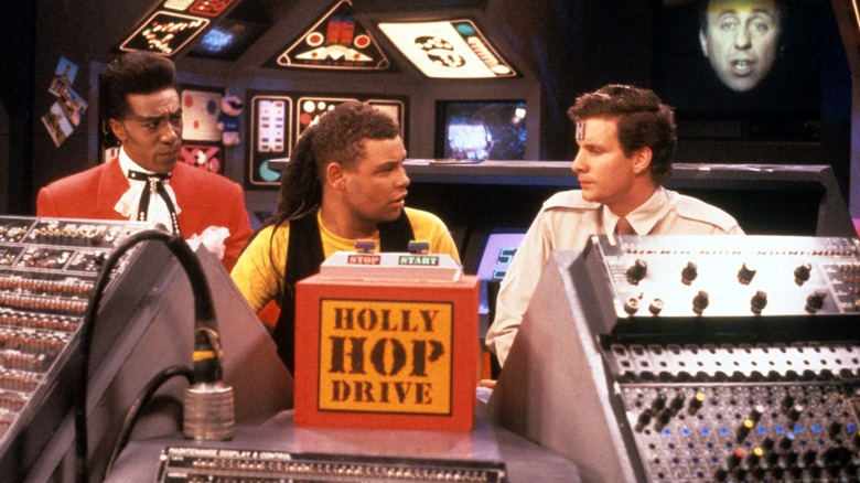 Cat, Dave, and Rimmer engage in conversation in the original run of Red Dwarf