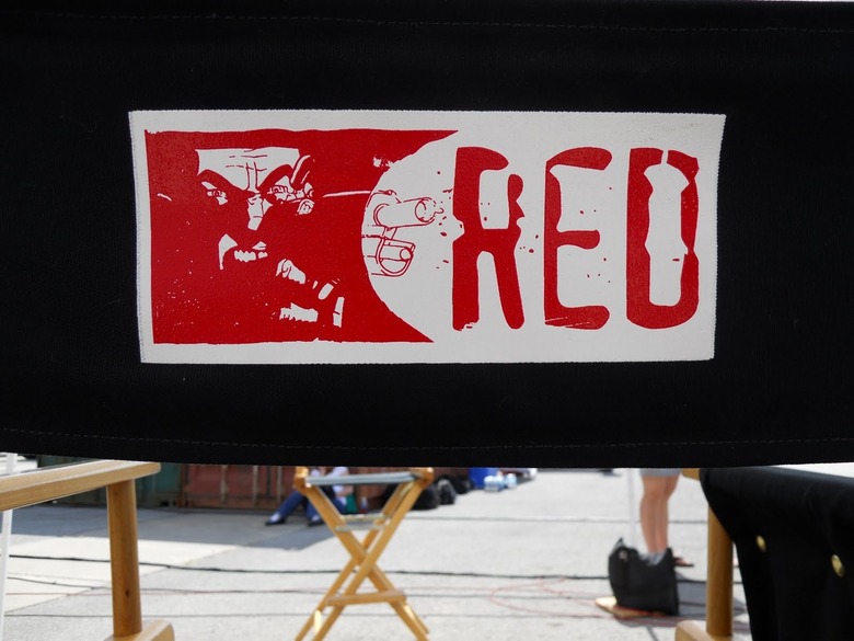 Red logo on chair