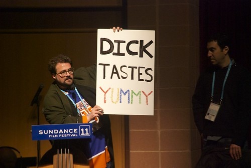 Kevin Smith Holds Up a Sign