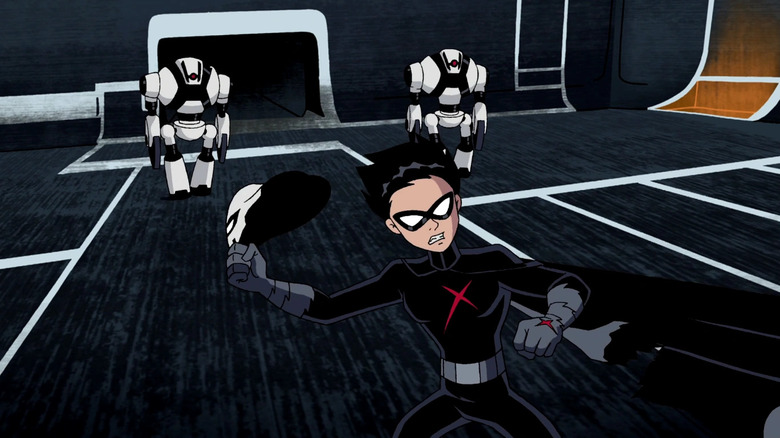 Robin holds the Red X mask in his hand in Teen Titans