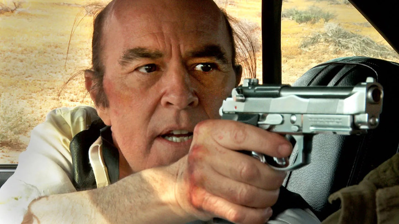 Reggie holding a gun in Phantasm: Ravager