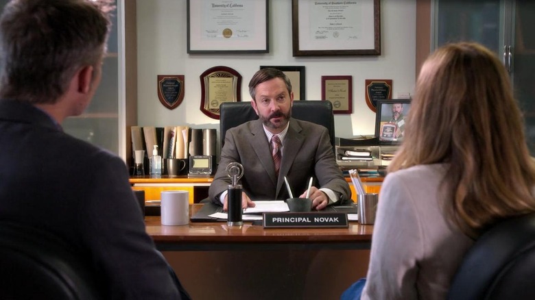 Thomas Lennon as Principal Novak sits at his desk in Santa Clarita Diet.