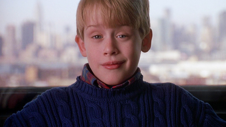 Kevin McCallister smirking while inside a cab in Home Alone 2: Lost in New York